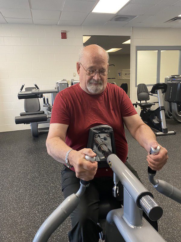 Tom using the Seated Row Machine